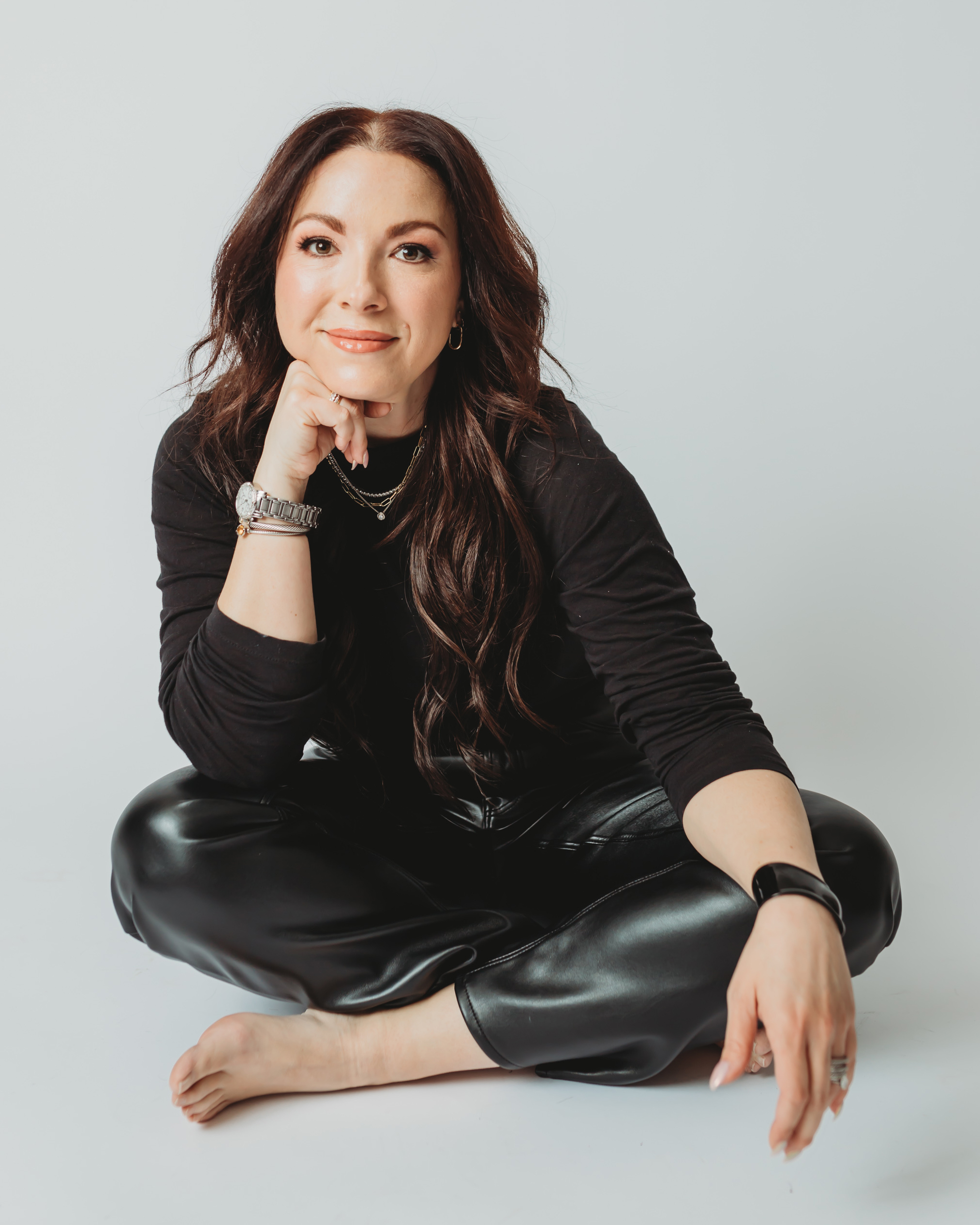 amber mayo from Salon AM sitting on the floor of a studio